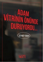 Adam Vitrinin nnde Duruyordu